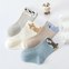 Assorted flat lay of 4 pairs of toddler combed cotton socks featuring playful animal ears and soft neutral tones