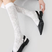 Women's Sheer Graphic Rose Calf Socks - product photo showing seamless stretch comfort
