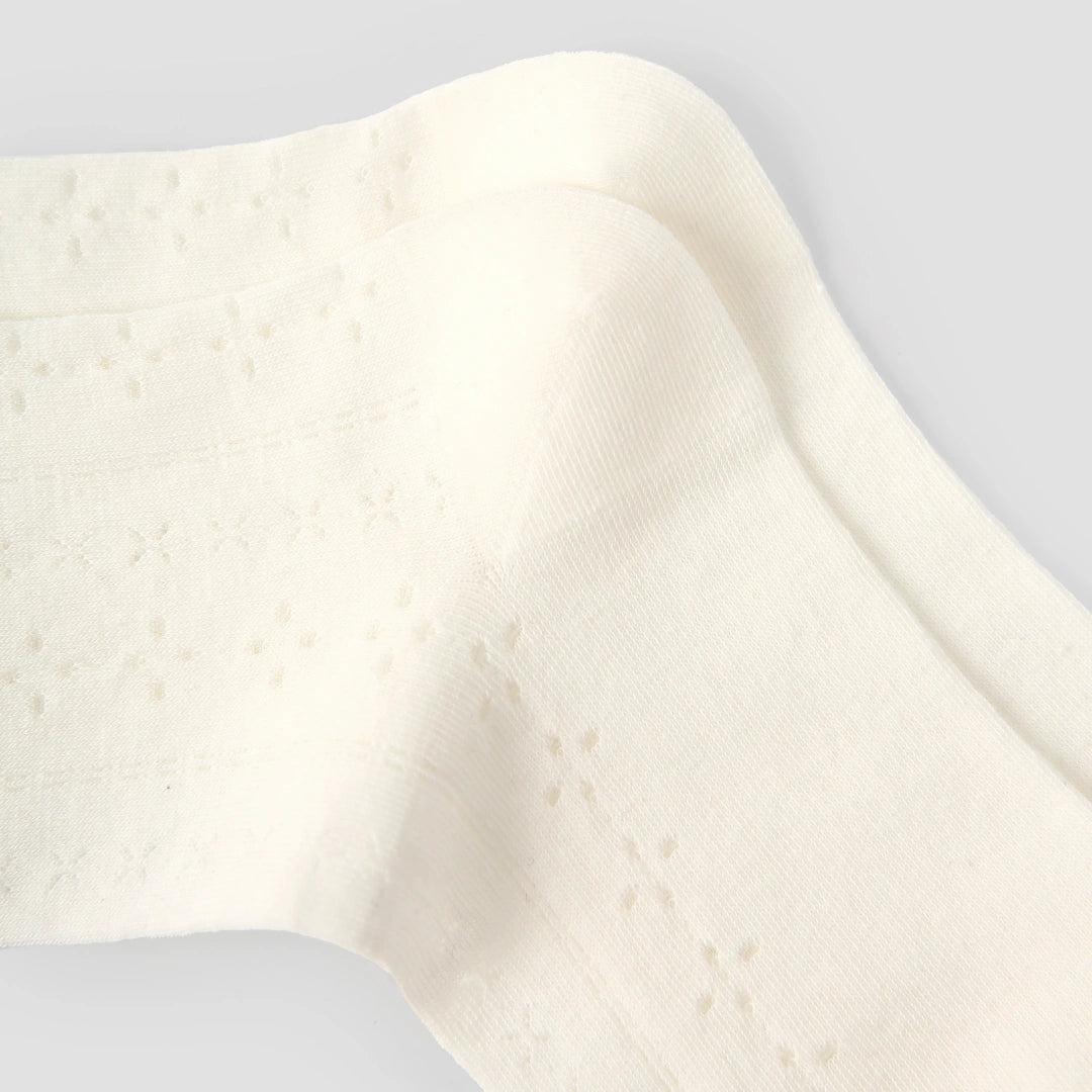 Women's Sheer Pointelle Calf Socks - product photo showing seamless stretch comfort