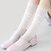 Women's Sheer Pointelle Calf Socks - product photo showing seamless stretch comfort